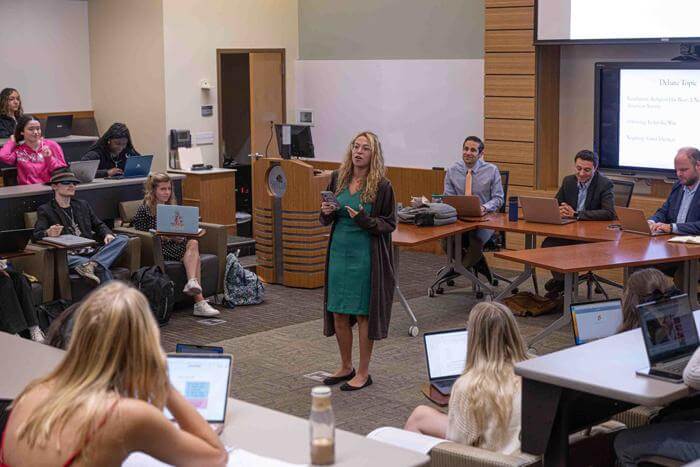 A photo of a debate between two teams of students in the Faith and Politics honors course at Saint Leo's University Campus in the spring of 2023