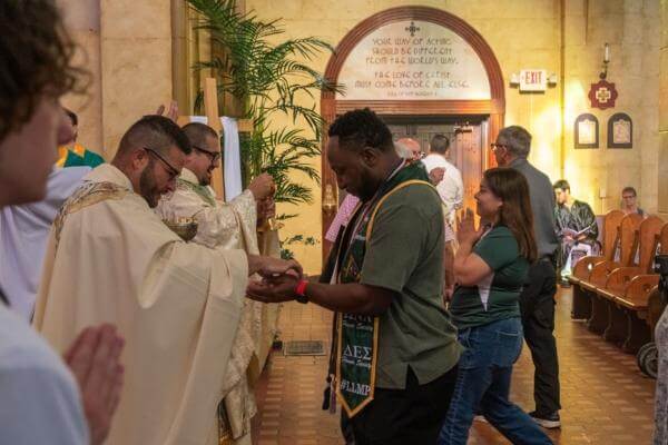 Student receiving communion