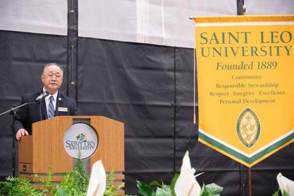 Retired Col. Peter Tan (DDS) speaks at ROTC commissioning